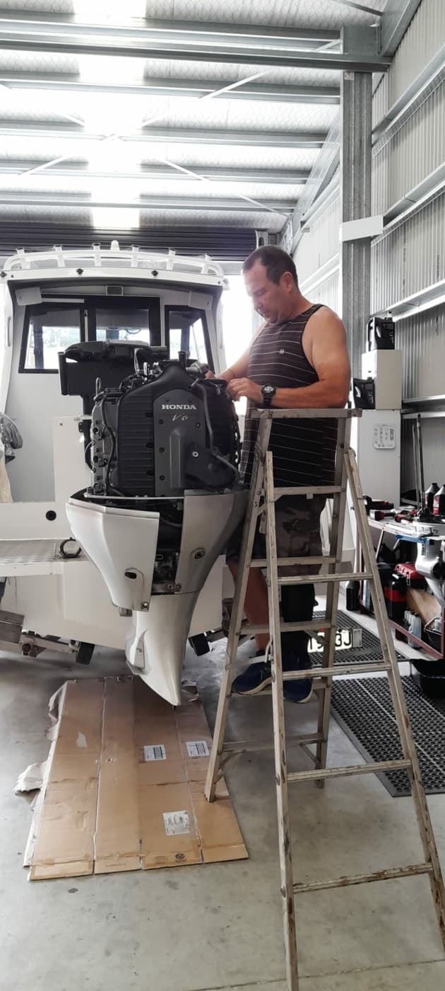 Honda V6 outboard with the cowling off being serviced in the BSM workshop