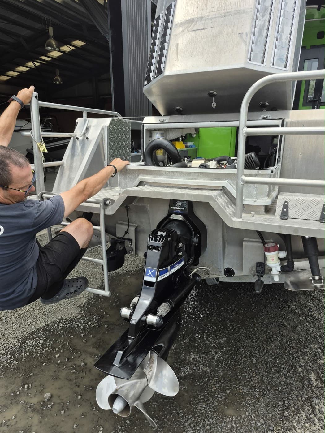 BSM technician working on the sterndrive leg of an alloy boat